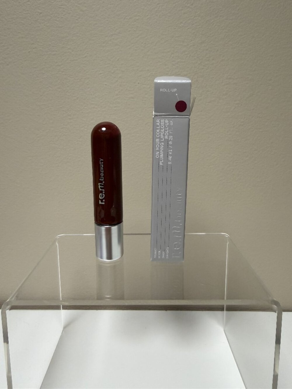 r.e.m. beauty by Ariana Grande On your collar plumping lip gloss Roll Up